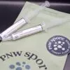 Syringes with Fungal Spores on green packaging, labeled Beginner Cubensis Spore Kit from PNW Spore.